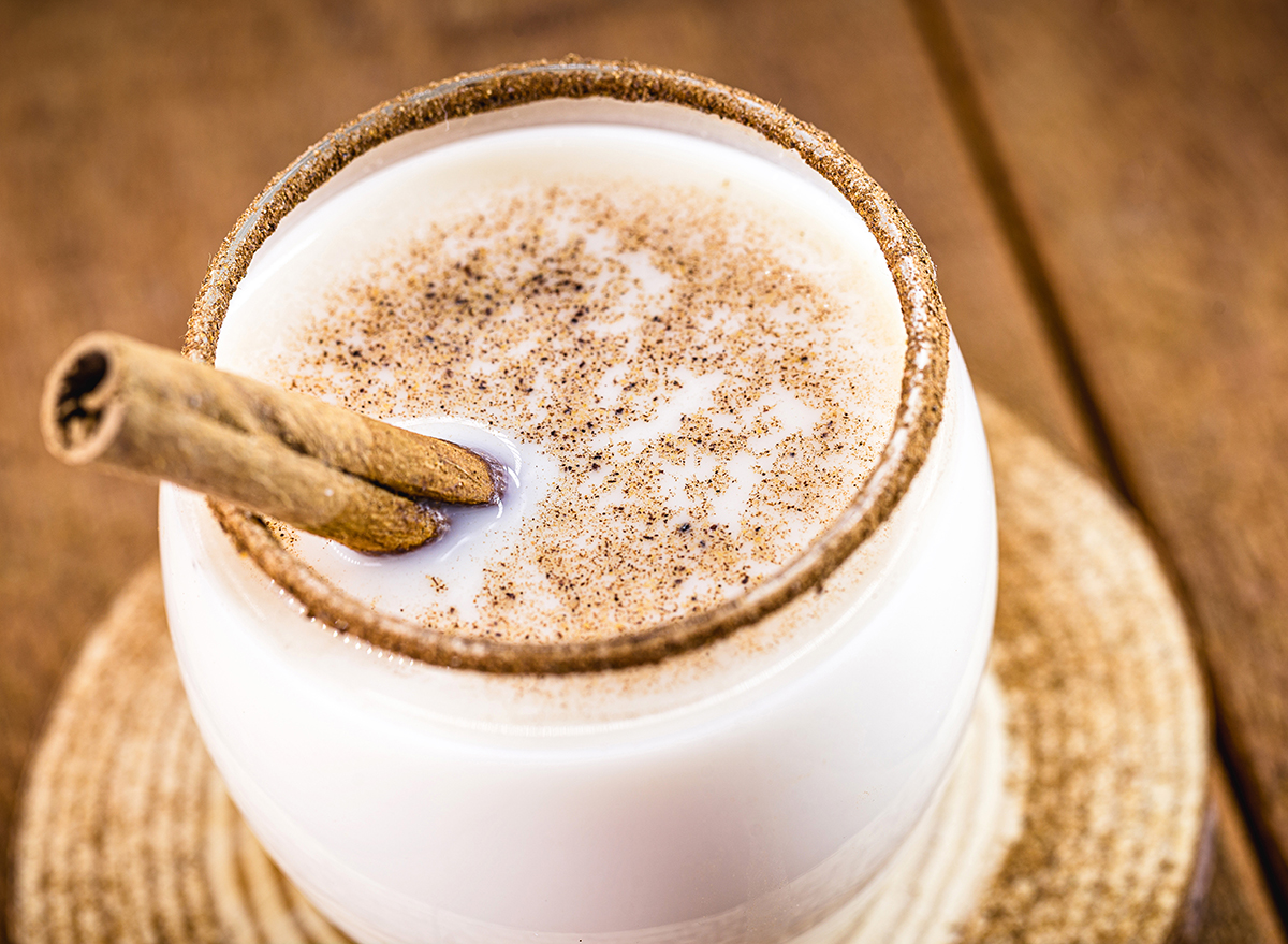 coquito drink with cinnamon stick