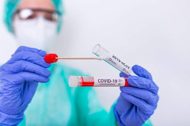 The nurse holds a test tube with blood for the 2019-nCoV test.  Blood test for new coronavirus