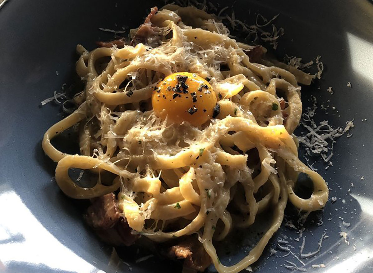 plate of fettuccine with egg on top