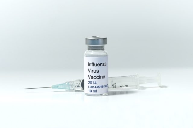 Influenza vaccine vial with syringe