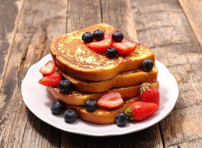 plate of french toast with berries