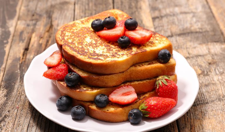 plate of french toast with berries