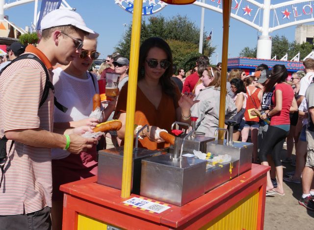 Putting ketchup mustard corndogs