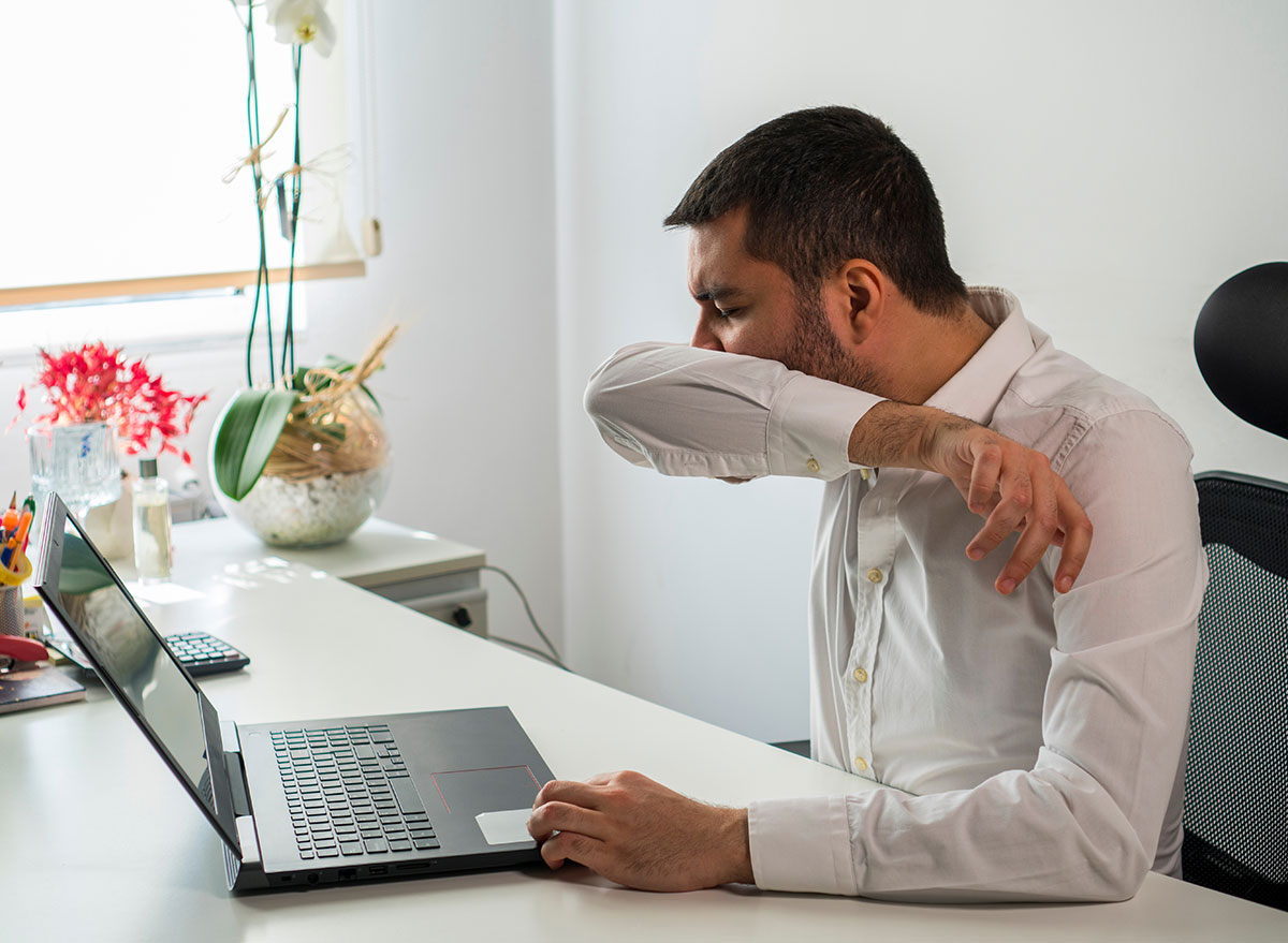 man coughing