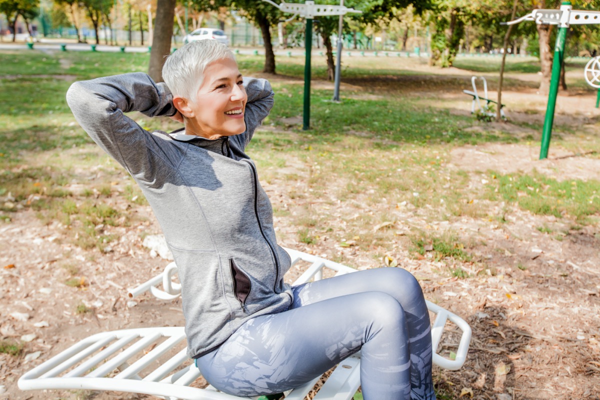 Active Senior Woman Exercise At Outdoor Gym