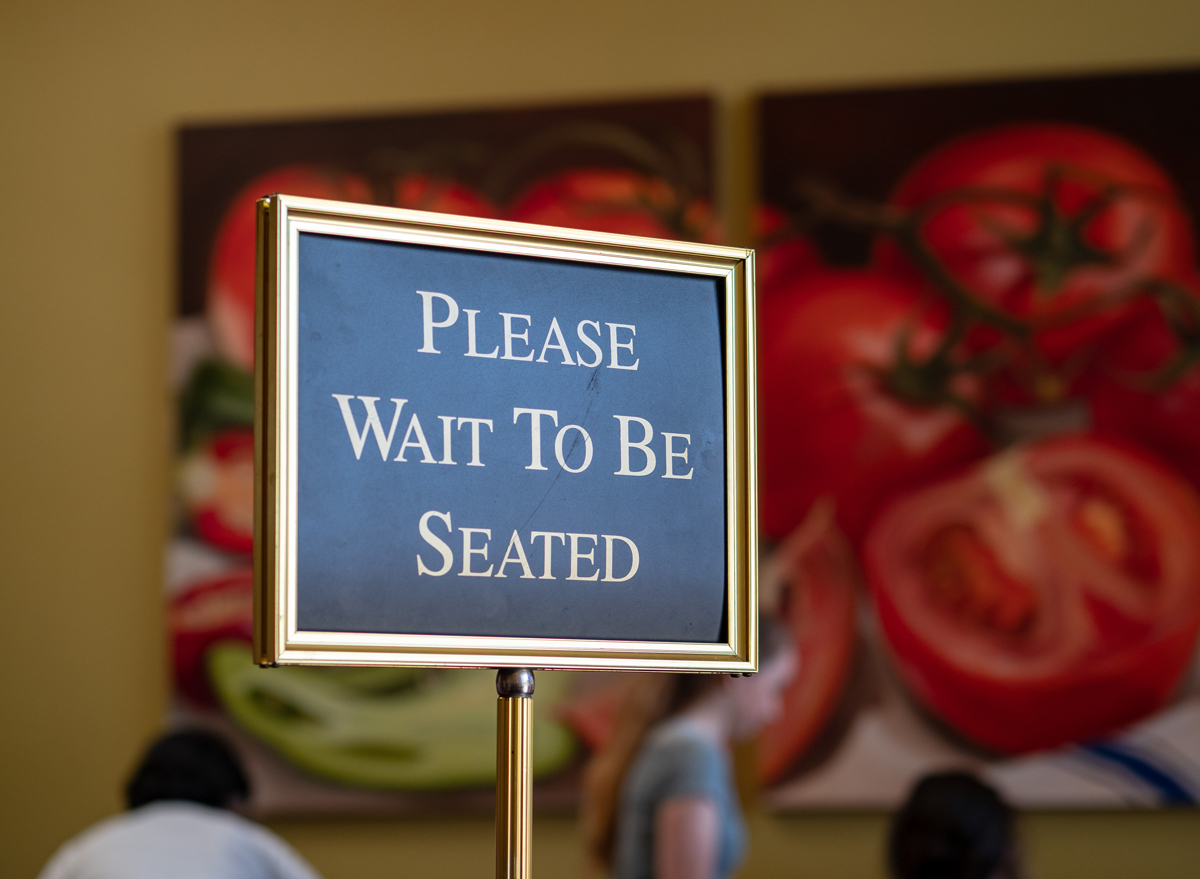 Please wait to be seated host stand
