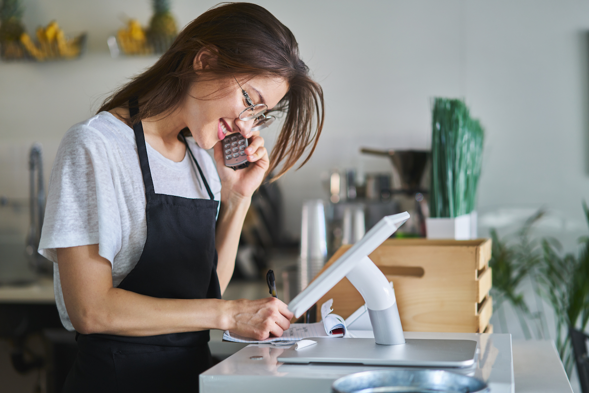 restaurant hostess on telphone