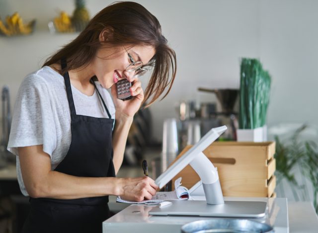 restaurant hostess on telphone