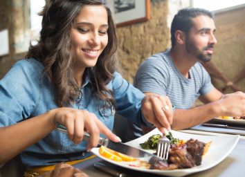 Couple having lunch at rustic gourmet restaurant