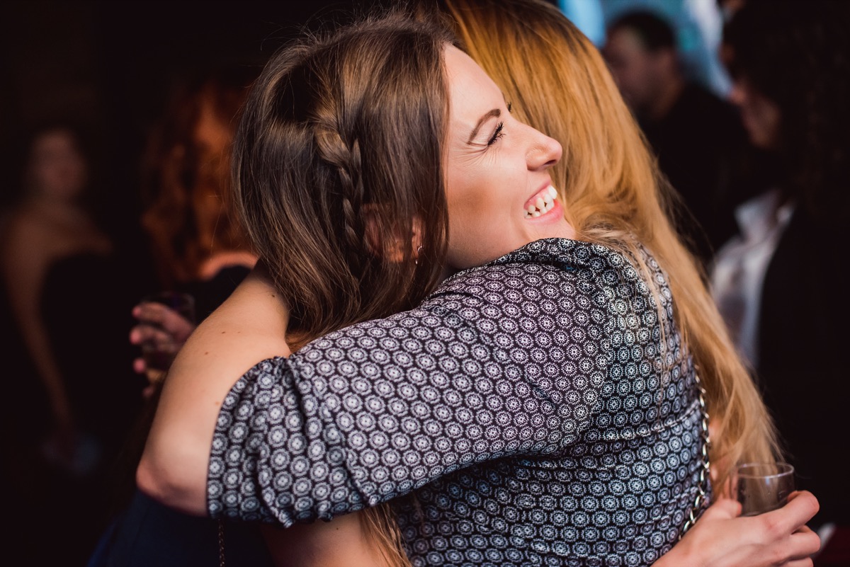 two white women hugging