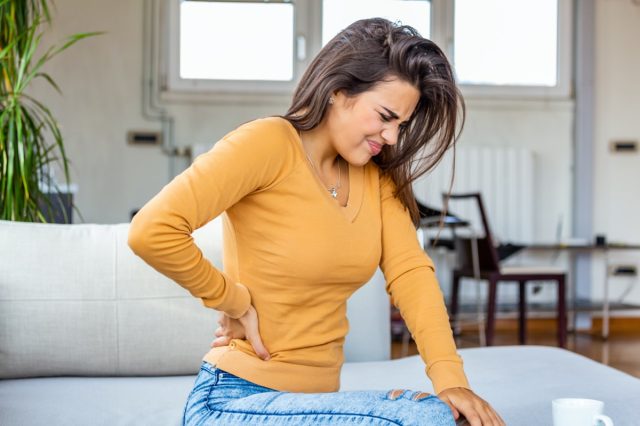 woman with spinal or kidney pain