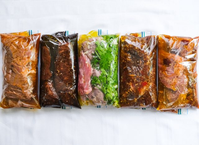five marinated steaks in small plastic bags