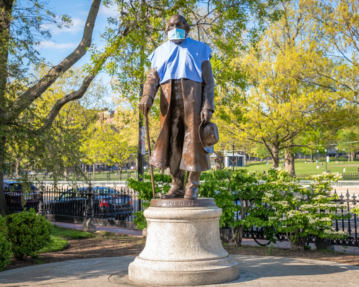 The Edward Everett Hale statue wears a gown and mask, placed by a Bostonian