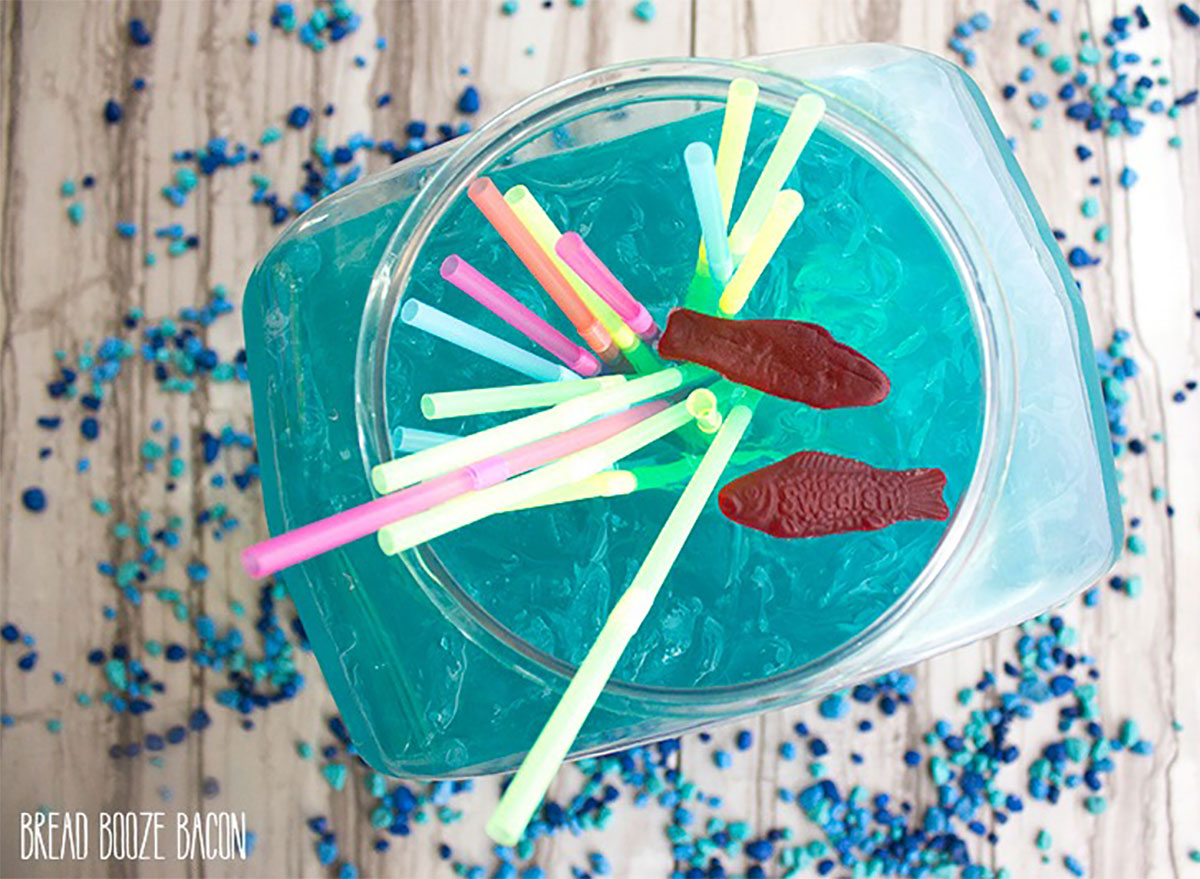 blue fishbowl cocktail with straws