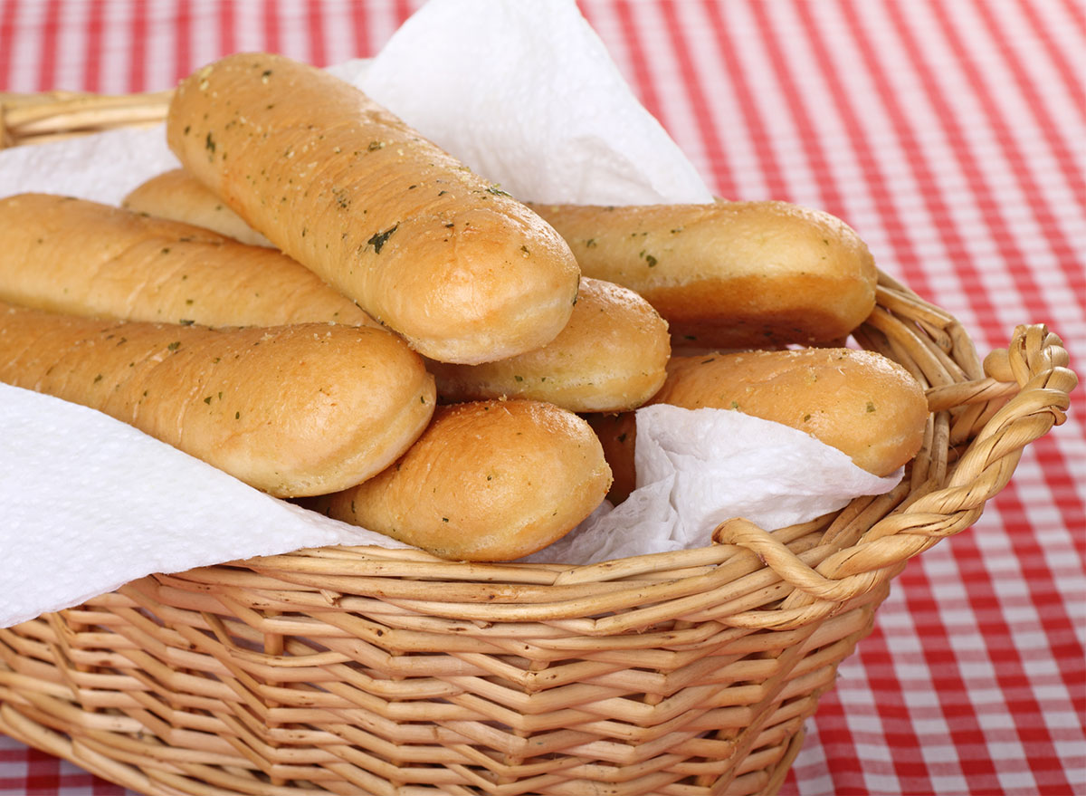 garlic breadsticks in a basket