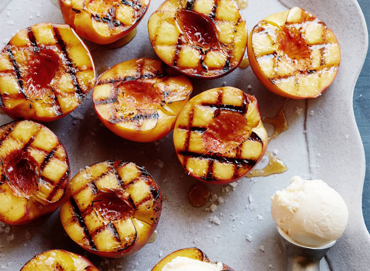 grilled peach halves with ice cream scoop
