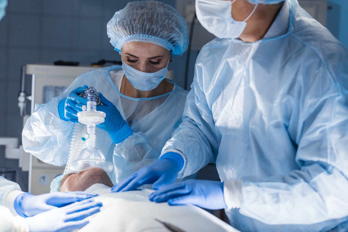 Team of experienced doctors and assistants performing surgery.