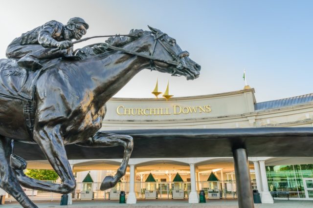 LOUISVILLE, KENTUCKY, USA - MAY 15 2016: Entrance to Churchill Downs featuring a statue of 2006 Kentucky Derby Champion Barbaro.