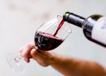 Pour glass red wine