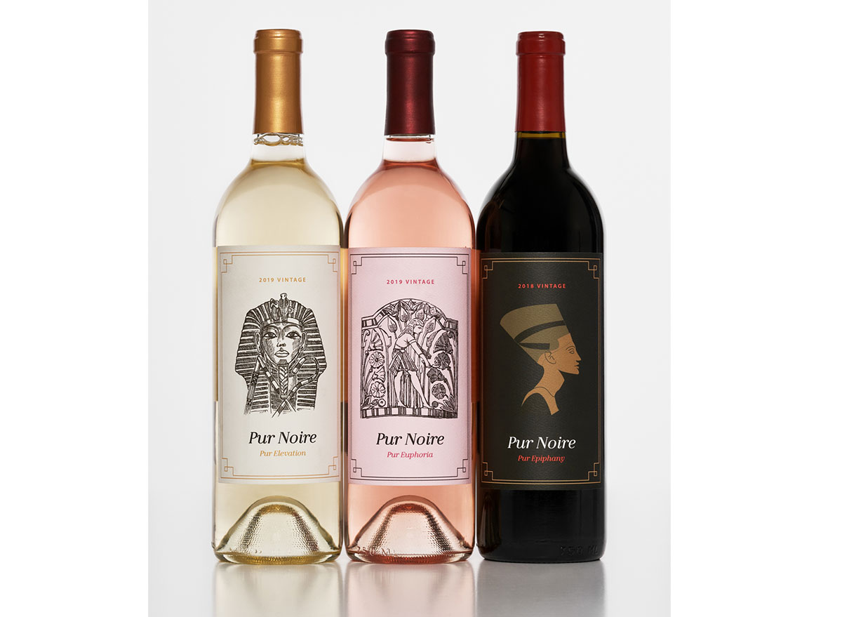 white rose and red wine bottles from pur noire