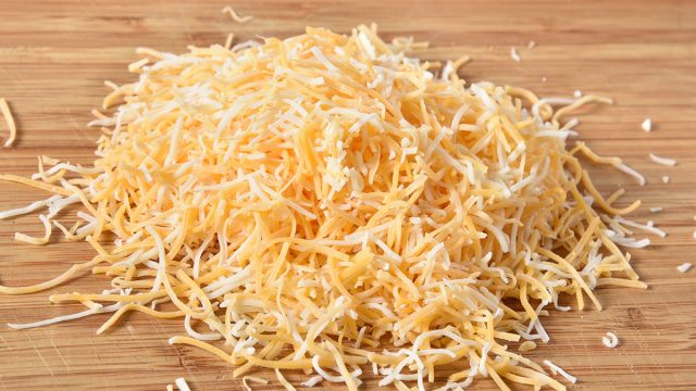 The Hidden Ingredient In Shredded Cheese Eat This Not That