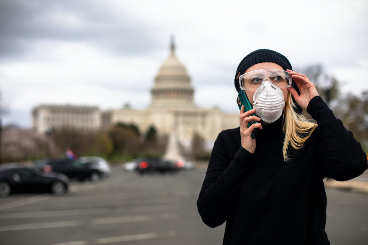 An American woman wears a mask and goggles at the U.S. Capitol building in Washington, D.C. to protect herself from the COVID-19 coronavirus.