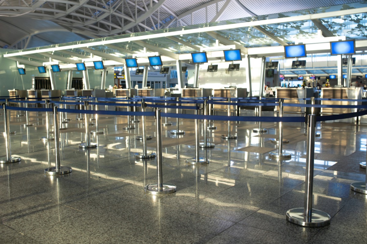 Coronavirus outbreak, empty check-in desks at the airport terminal due to pandemic of coronavirus and airlines suspended flights.