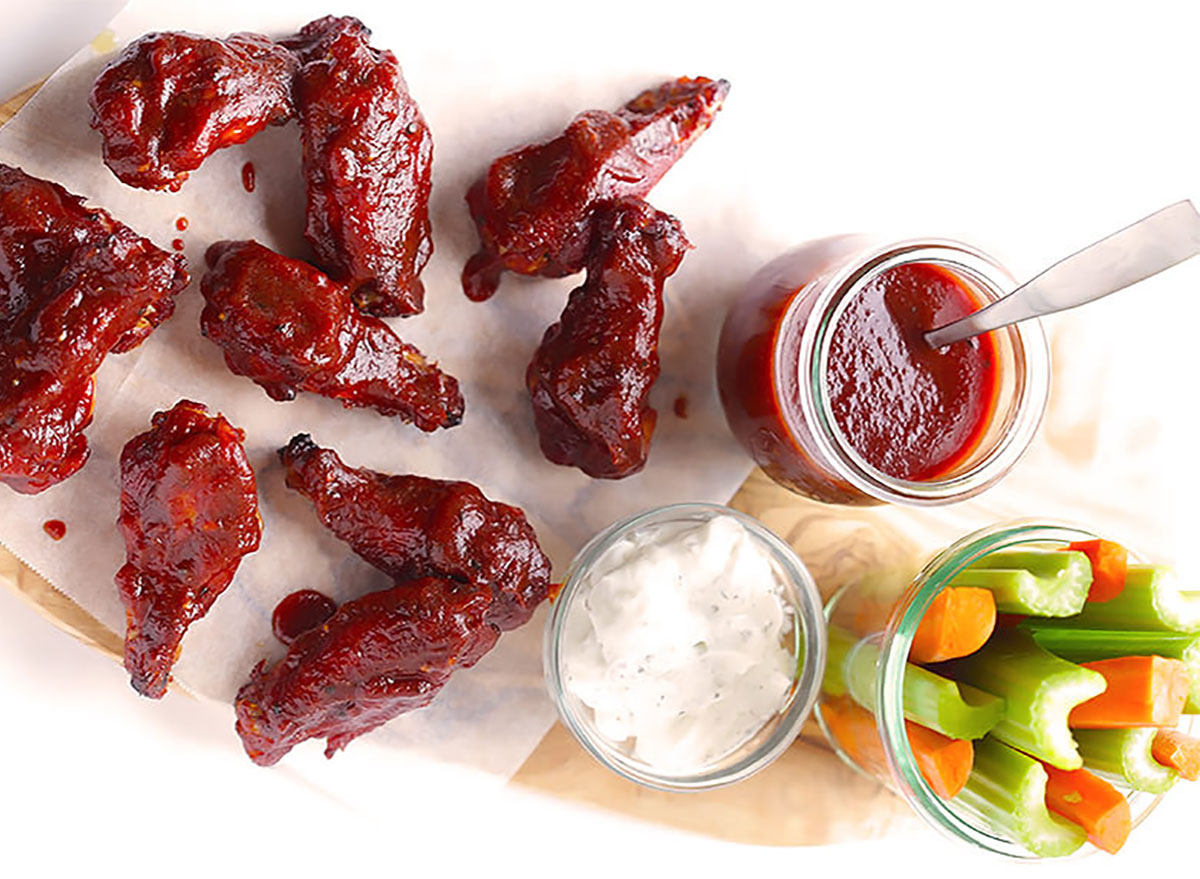 barbecue baked chicken wings with dipping sauce and crudites