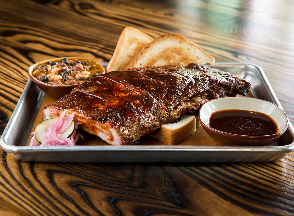 plate of ribs and sauce from char bar in kansas city