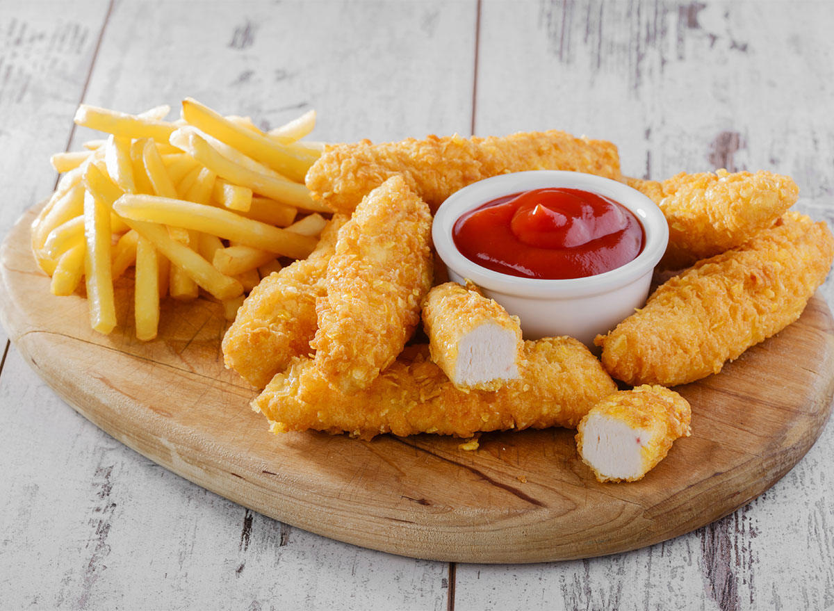 plate of chicken tenders and fries with ketchup