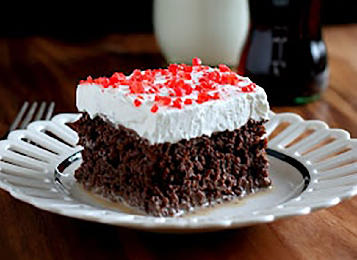 coca cola tres leches cake slice on plate