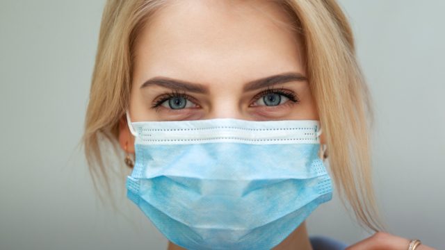 Women In A Medical Mask