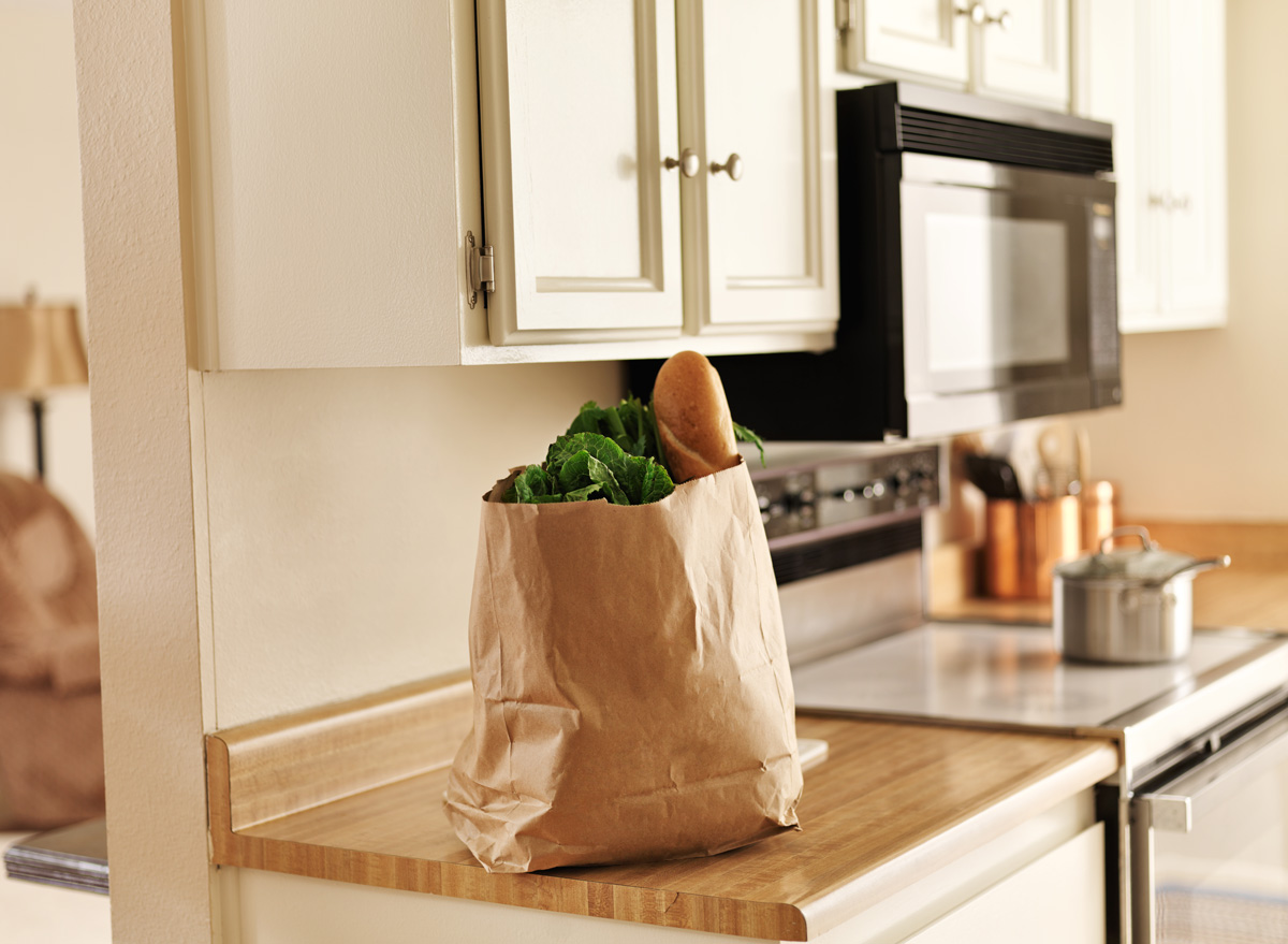 Groceries sitting in bag on kitchen counter