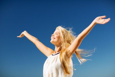 happy woman enjoying summer outdoors