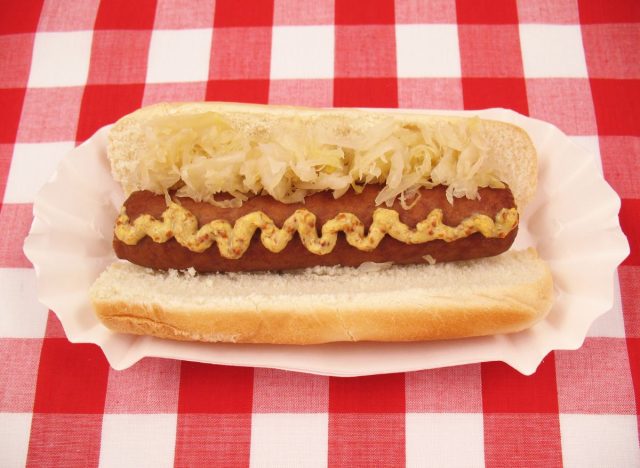 hot dog with sauerkraut and brown mustard