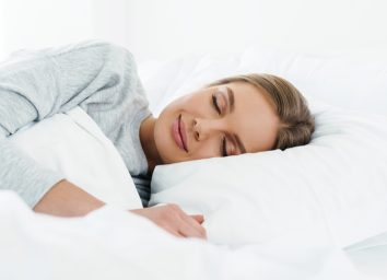 woman smiling while sleeping