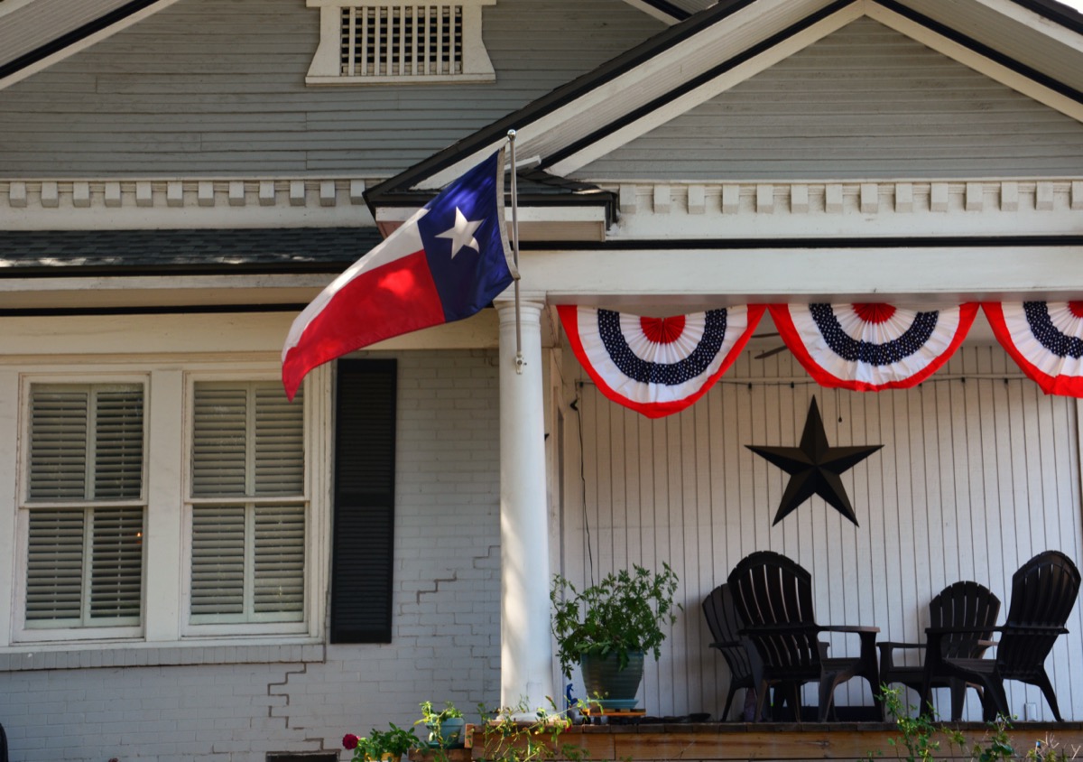House with Texas flag on the lawn