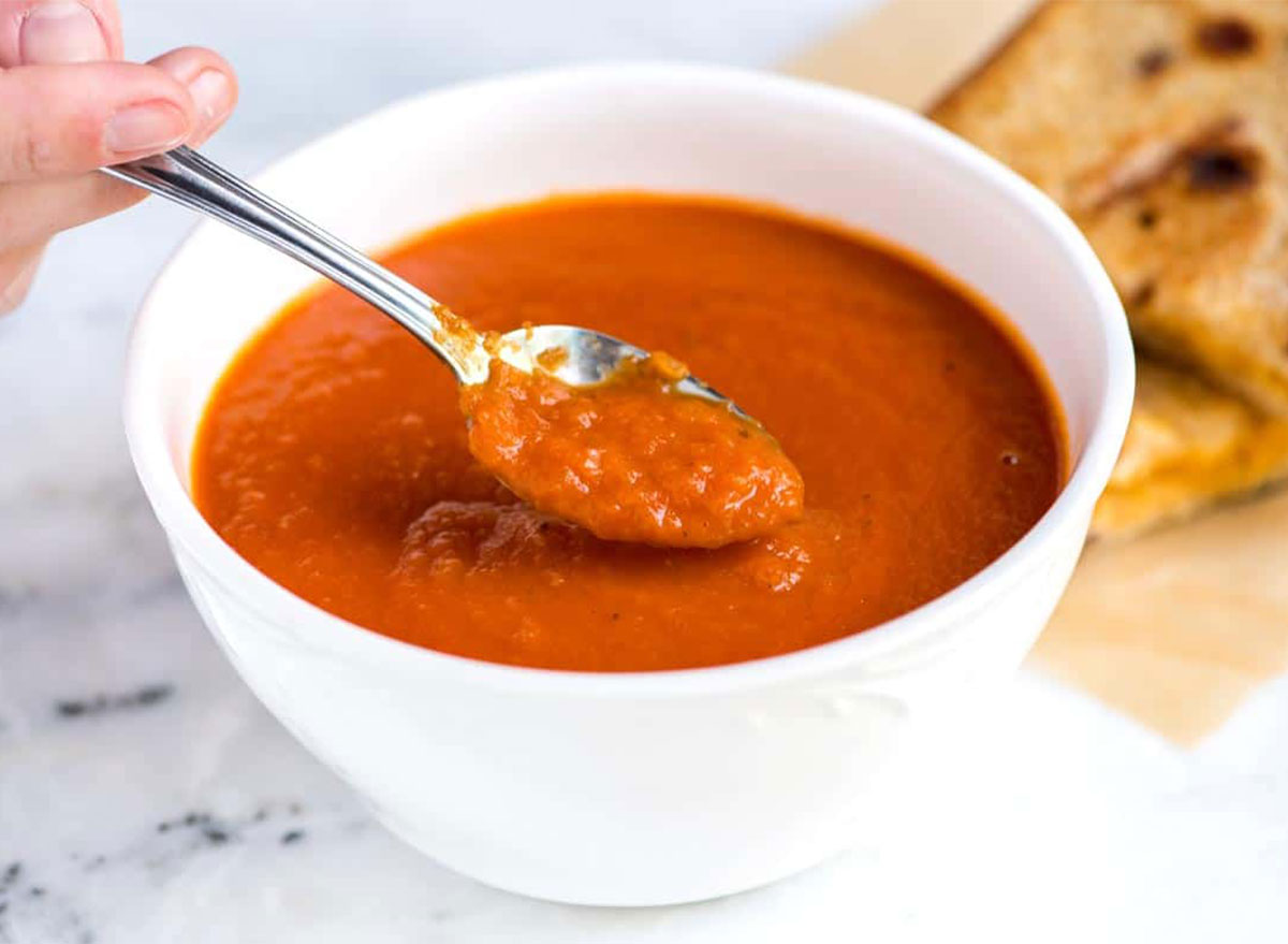 tomato soup in bowl with spoon