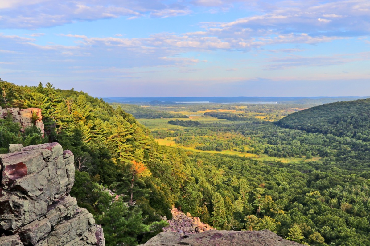 Areal view from rocky ice age hiking trail during sunset hours. Devil's Lake State Park, Baraboo area, Wisconsin, Midwest USA.