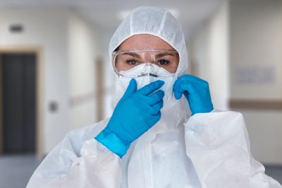 Women doctor wearing protective suit to fight coronavirus pandemic covid-2019.