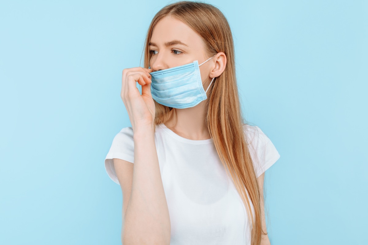 wears a hygiene mask to prevent infection, airborne respiratory disease