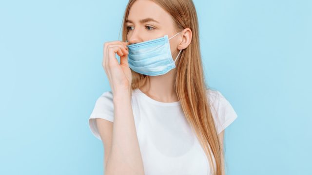 wears a hygiene mask to prevent infection, airborne respiratory disease