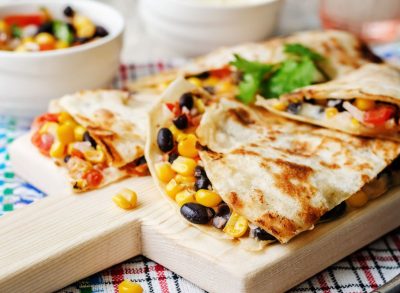 quesadilla on a wooden serving plate