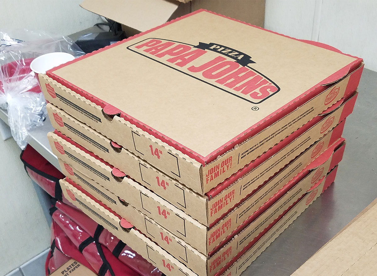 stack of papa johns pizza boxes