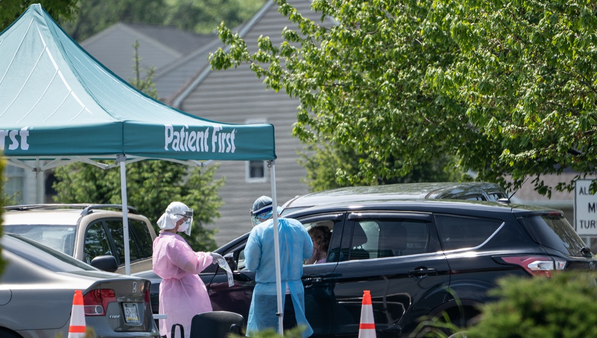 Berks County, Pennsylvania-May 15, 2020: Patient being tested in her vehicle at Patient Frist drive-through coronavirus COVID-19 testing location.