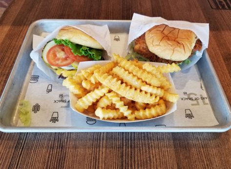 shake shack burger chicken and fries on tray