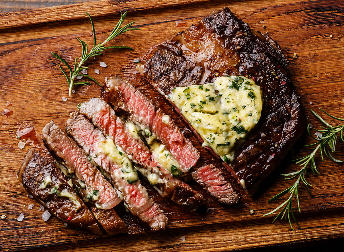 sliced steak topped with compound butter