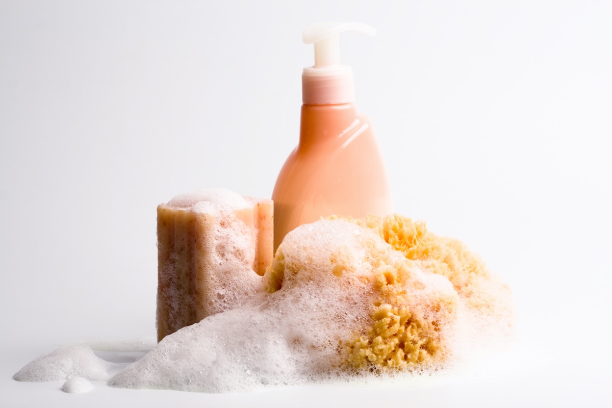 soap, natural sponge and shower gel closeup