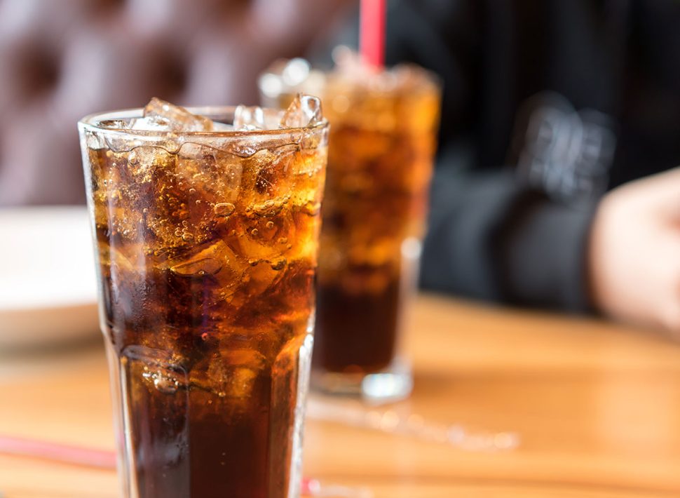 Warning Signs You're Drinking Too Much Soda, Says the Mayo Clinic