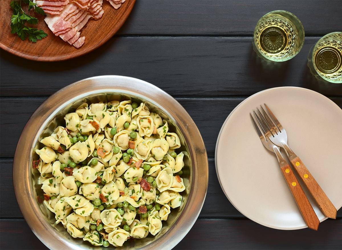 tortellini pasta salad in bowl with forks